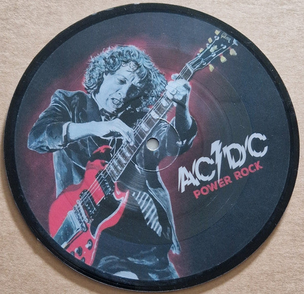 AC/DC vinyl record featuring Angus Young playing a red guitar.