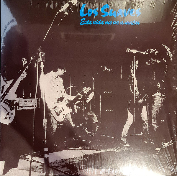 Black and white vinyl record cover featuring a band performing onstage.