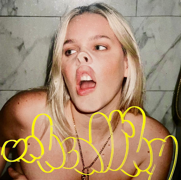 Anne-Marie album cover with artist making a playful face, yellow text.