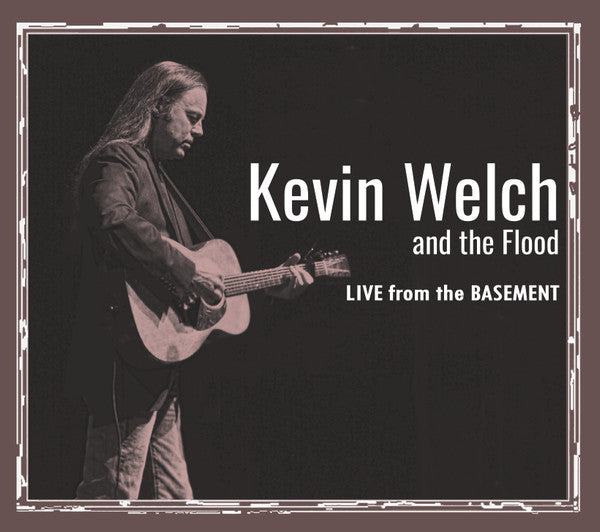 Kevin Welch playing acoustic guitar, album cover for "Live From The Basement.