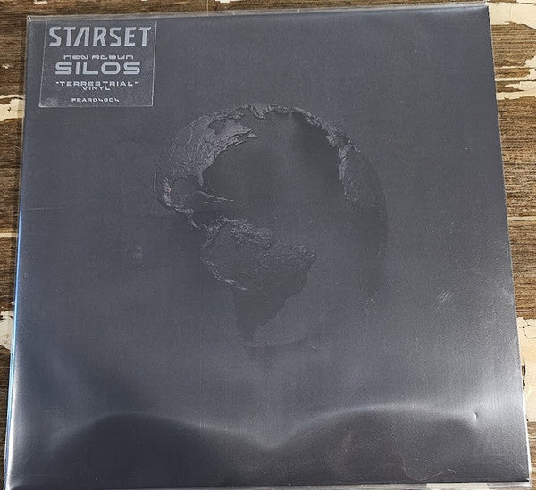 Black vinyl record cover for Starset’s “Silas” album, with textured imagery.