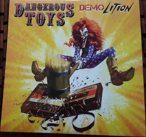 Album cover for Dangerous Toys’ “Demolition” featuring a clown and broken cassette tapes.