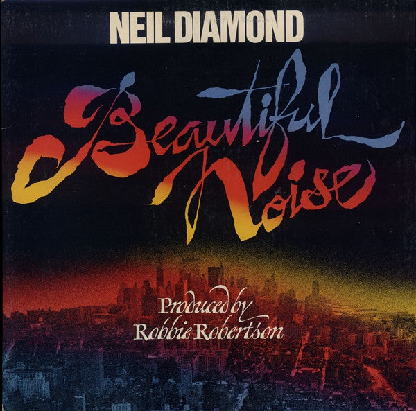 Neil Diamond Beautiful Noise vinyl album cover with city skyline and colorful script text.