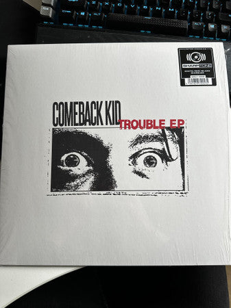 Vinyl record for Comeback Kid’s “Trouble EP” with intense eye graphic.