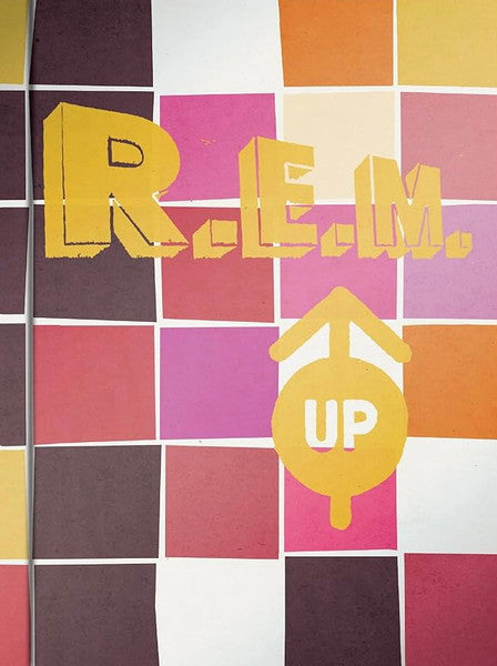 Blu-ray cover for R.E.M.’s “Up” with colorful geometric patterns.