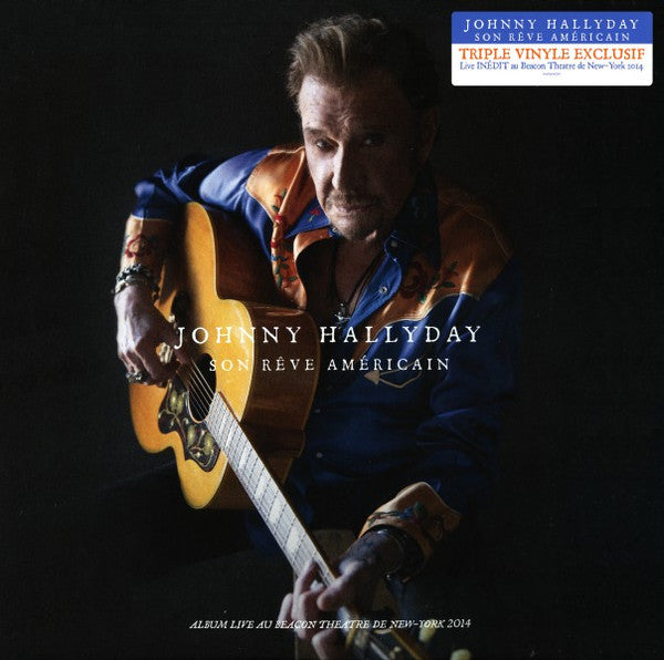 Johnny Hallyday album cover featuring a man playing an acoustic guitar.