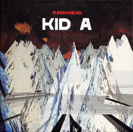 DVD cover for Radiohead’s “Kid A” featuring snowy mountains and red text.
