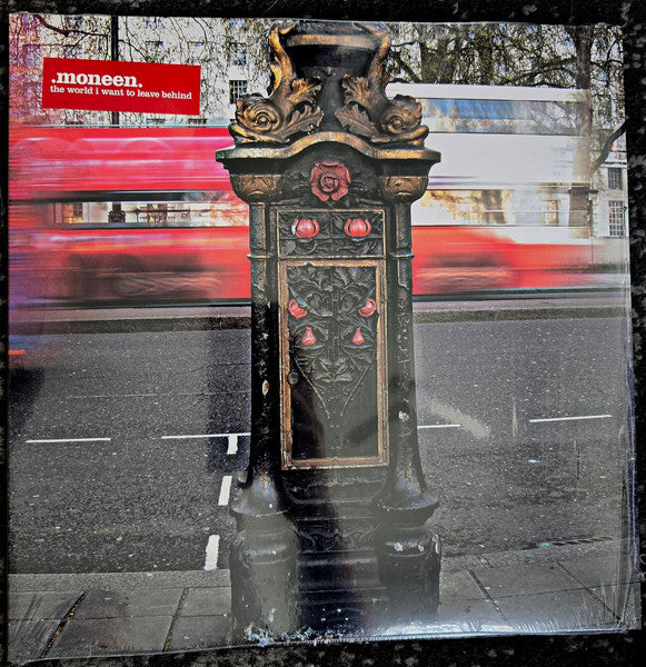Vinyl record cover featuring a red bus and ornate black pillar.