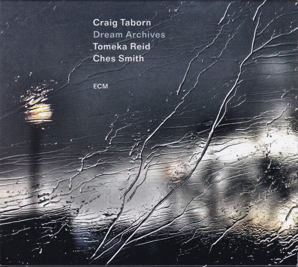 CD cover for "Dream Archives" by Taborn, Reid, and Smith, dark textured design.