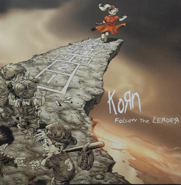 Korn's "Follow The Leader" CD cover: children, hopscotch, and stormy sky.