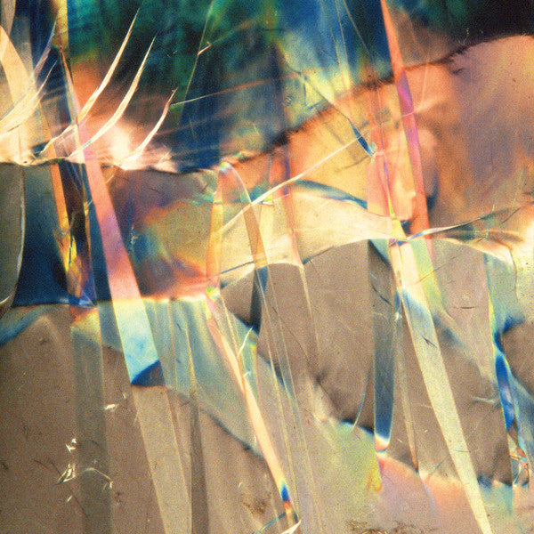 Abstract vinyl record cover with colorful, refracted light patterns.