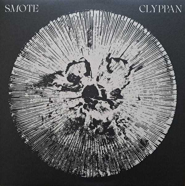 Black vinyl record cover with a white, radial, abstract design.