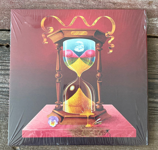 Sealed vinyl record cover with an hourglass and floral imagery.