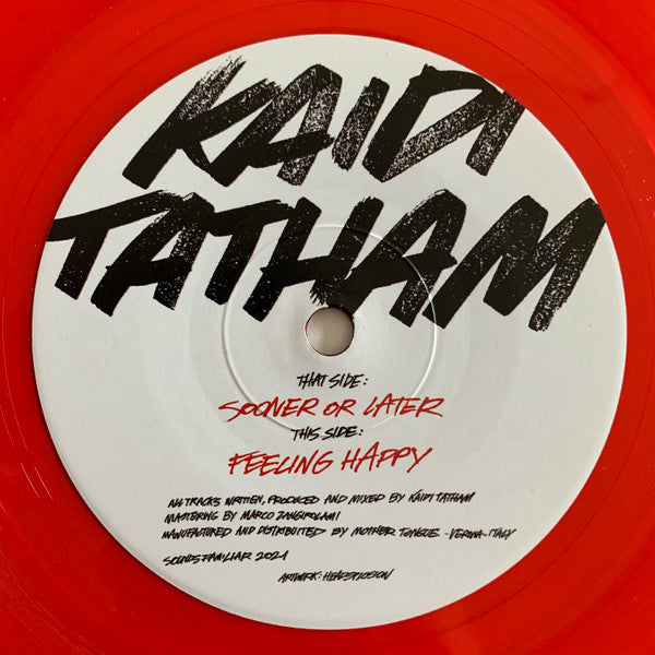 White vinyl record with black text: "Kaidi Tatham" and tracklist details.