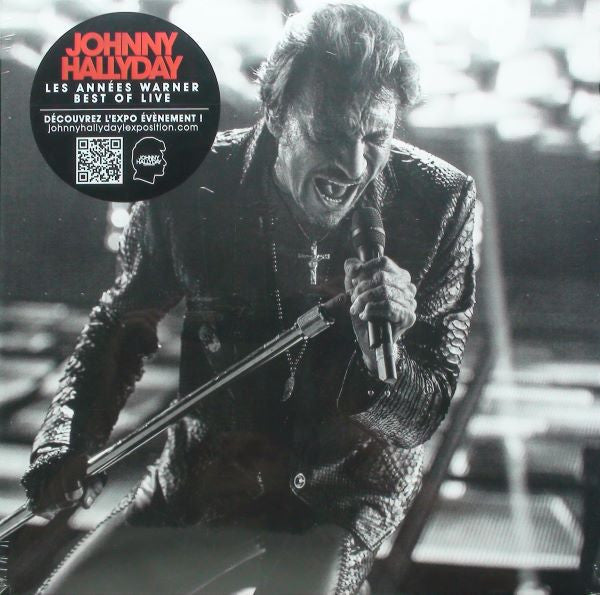 Johnny Hallyday live album cover featuring a performer with a microphone.