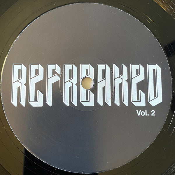 Black vinyl record with white text reading "REFREAKED Vol. 2".