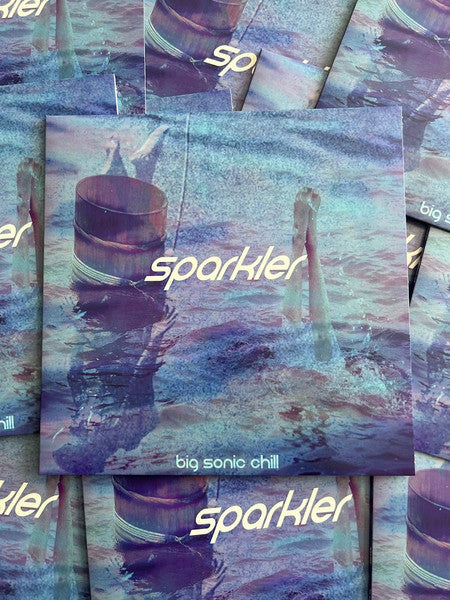 Purple vinyl record cover with blurry image of a sparkler.