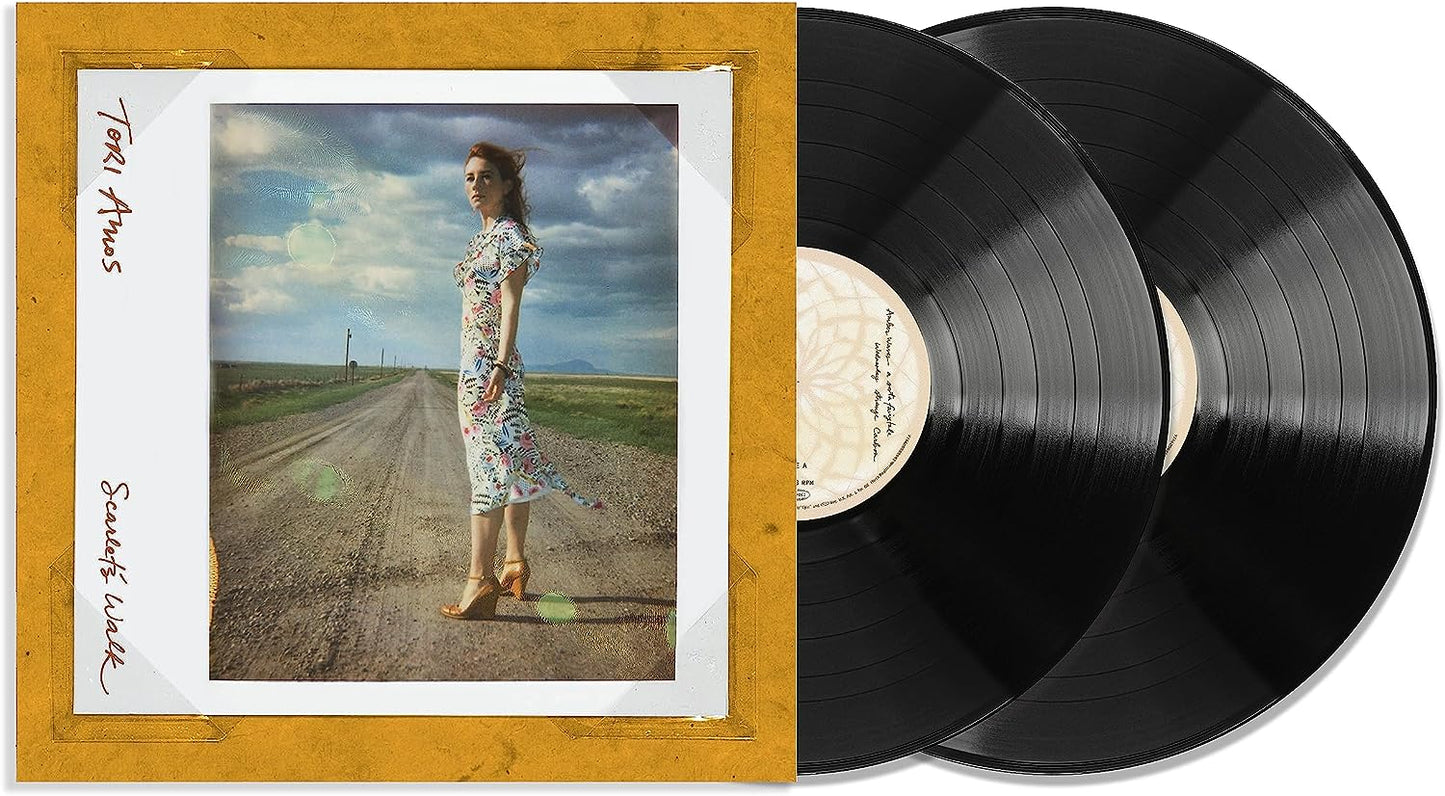Tori Amos' vinyl record "Scarlet's Walk" with a woman on a road cover.