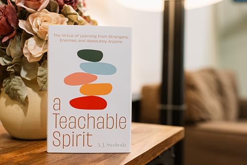 Book cover with stacked stones illustration and title “A Teachable Spirit.”
