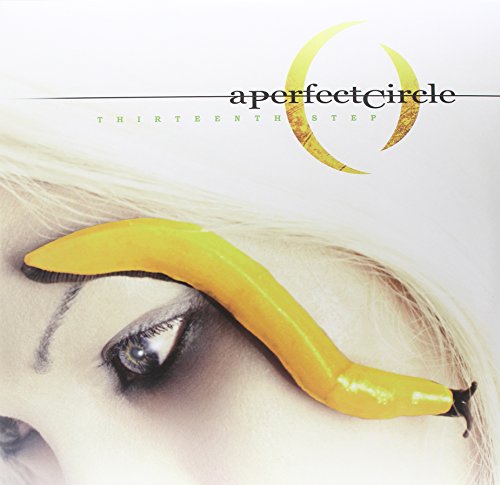 Album cover showing a yellow slug on a person's face near their eye.