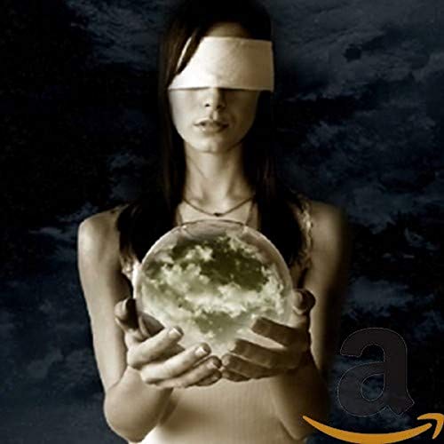 Woman with blindfold holding a snow globe against a dark sky.