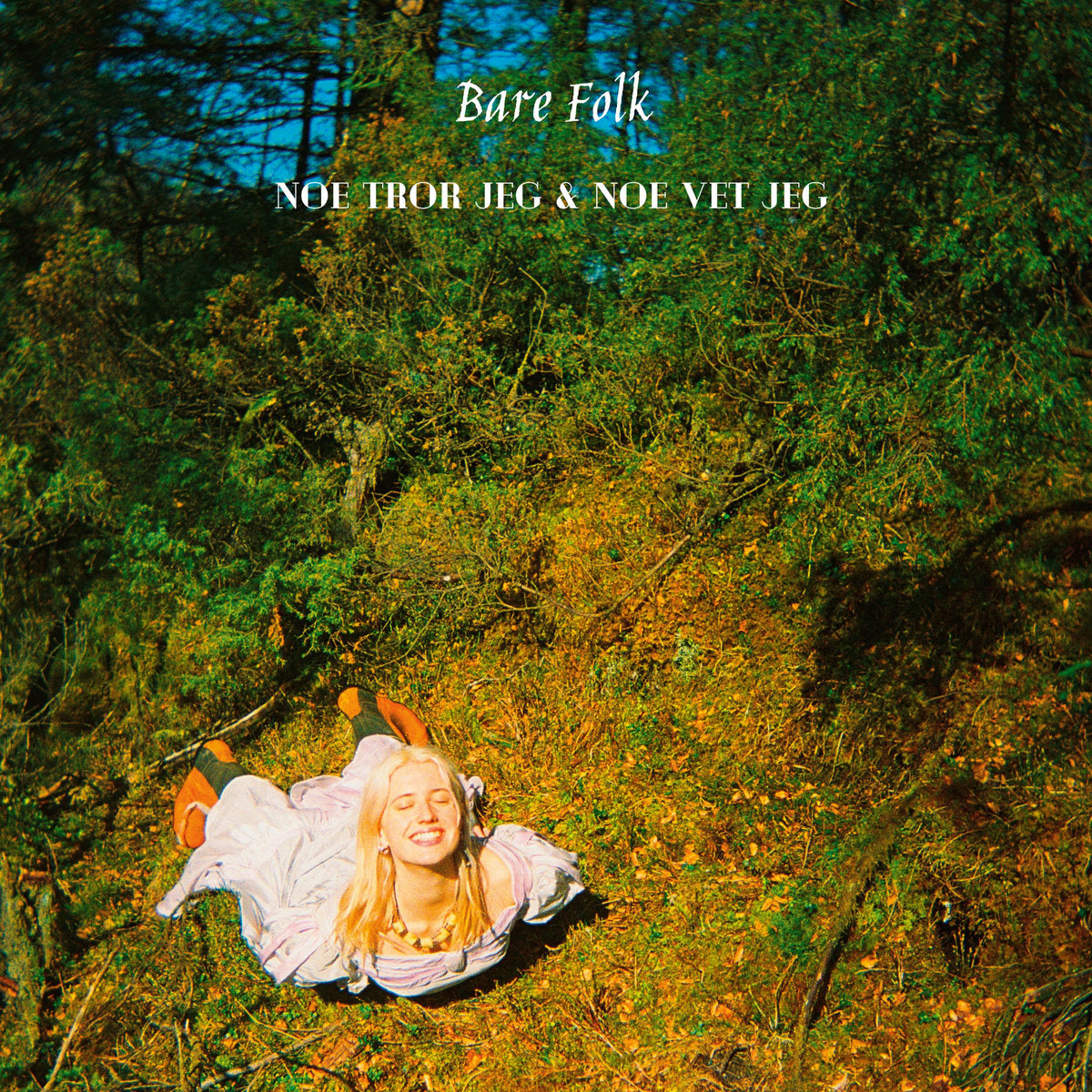 Vinyl album cover: woman lying in a forest, titled "Bare Folk".