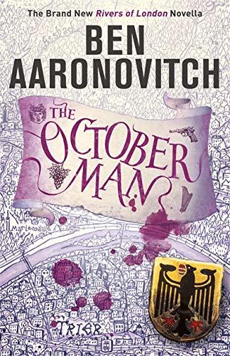 Book cover for "The October Man" with illustrated scroll and crest.