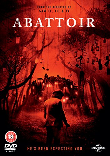 DVD cover of "Abattoir" featuring a silhouetted figure approaching a haunted house.