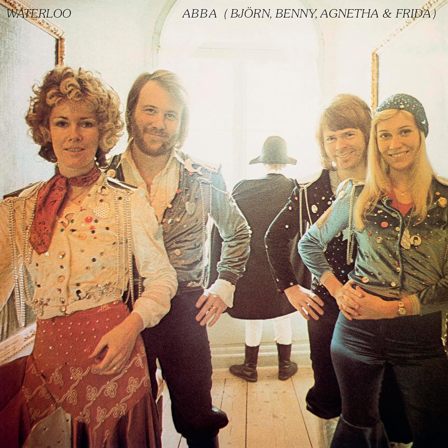 ABBA’s “Waterloo” vinyl album cover featuring the band members in vintage attire.
