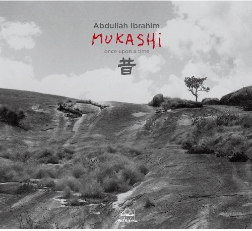 "Black and white landscape album cover with red and black text and Amazon logo."