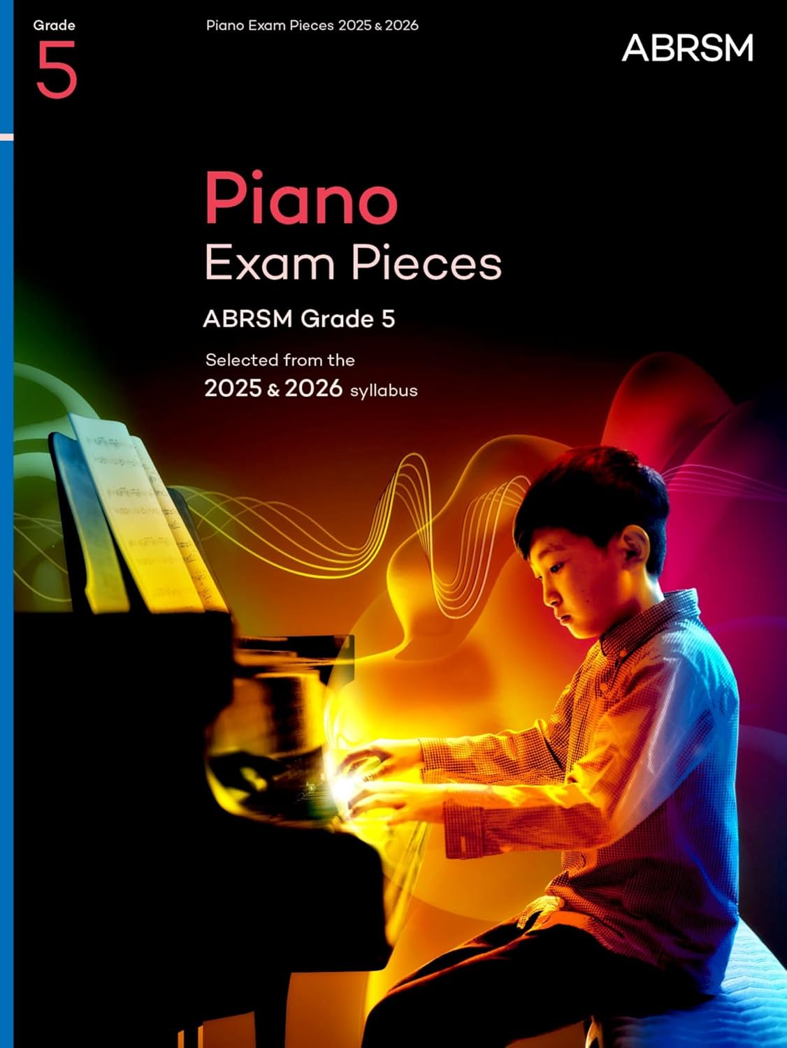 Book cover showing a boy playing piano with colorful abstract light waves.