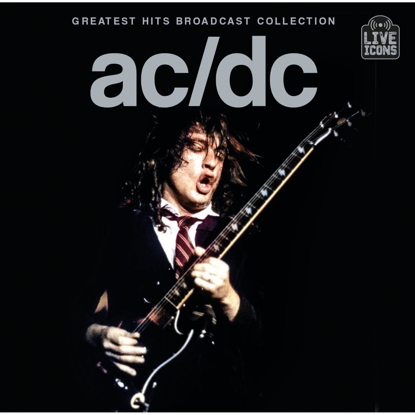 Angus Young playing guitar on stage with AC/DC Greatest Hits Broadcast Collection album cover.
