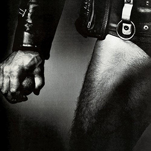 Black and white album cover featuring a person in leather and straps.