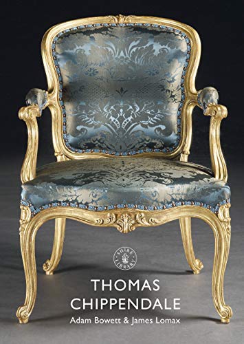 Ornate gold armchair with blue patterned fabric, book cover detail.