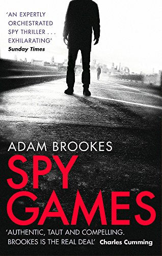 Book cover: silhouetted man on a road, title "Spy Games" in red.
