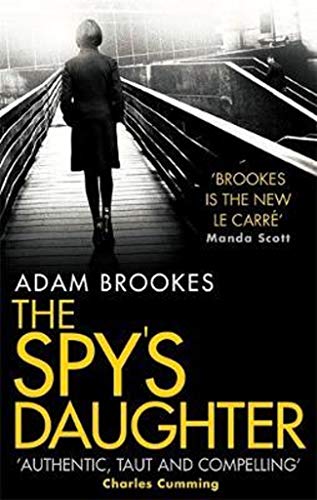 Book cover: woman on a bridge, title “The Spy’s Daughter”.