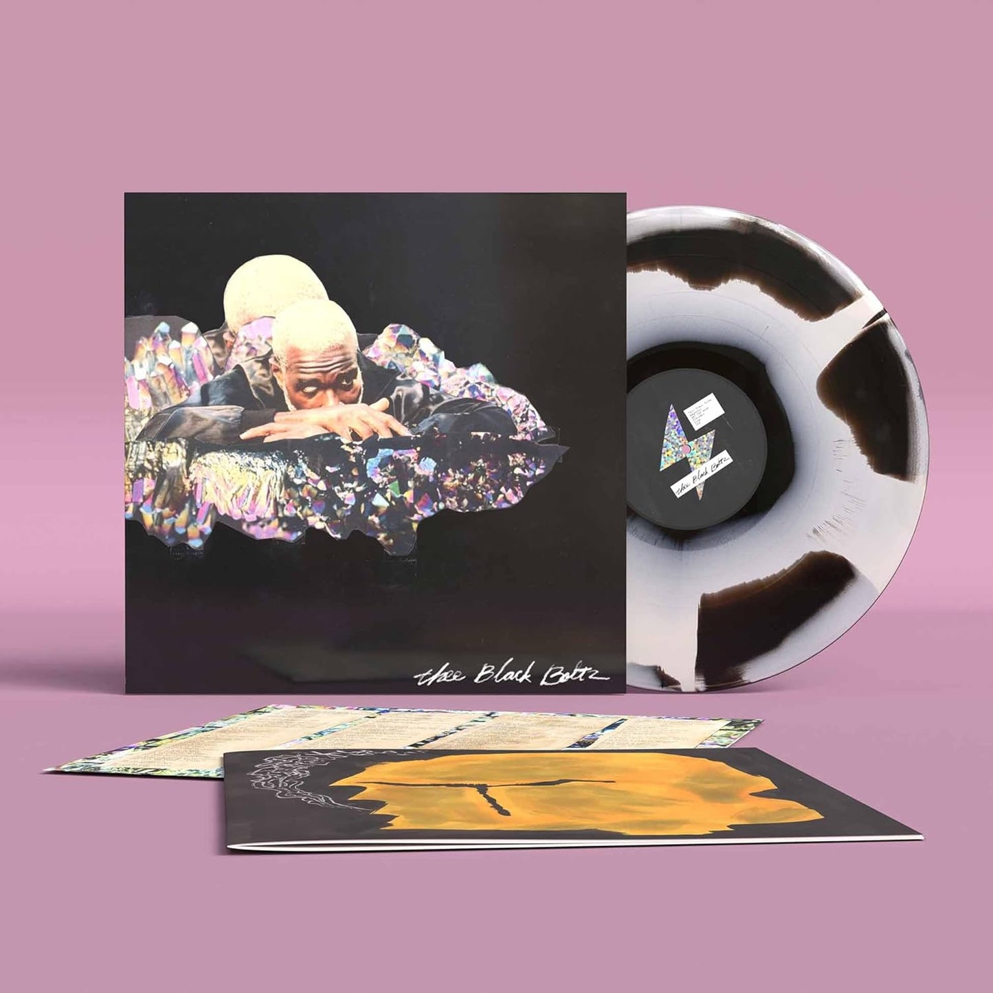 Vinyl record of Adebimpe, Tunde’s “Thee Black Boltz” with colorful cover art.