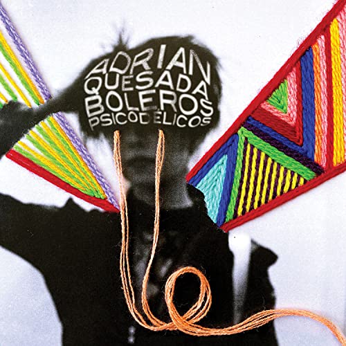 CD cover with a shadowed face framed by colorful, patterned yarn.