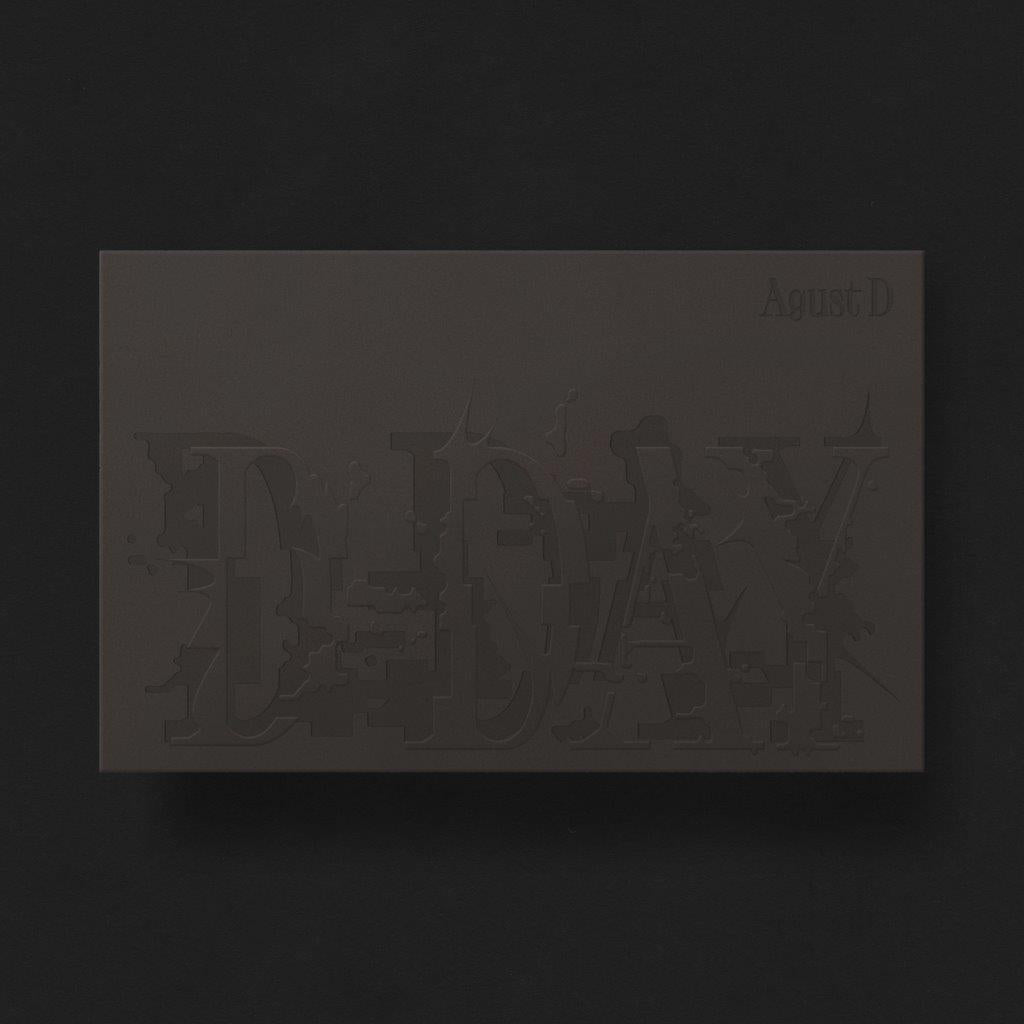 Dark gray CD packaging for Agust D’s “D-DAY” with embossed lettering.