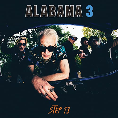 Alabama 3 album cover featuring band members reflected in a car mirror.
