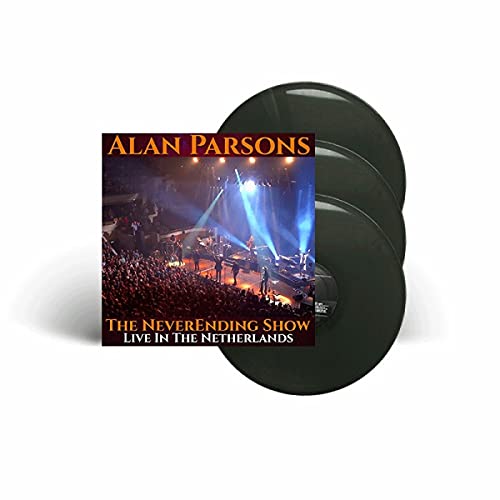 Three dark vinyl records with a concert stage image on the top record.