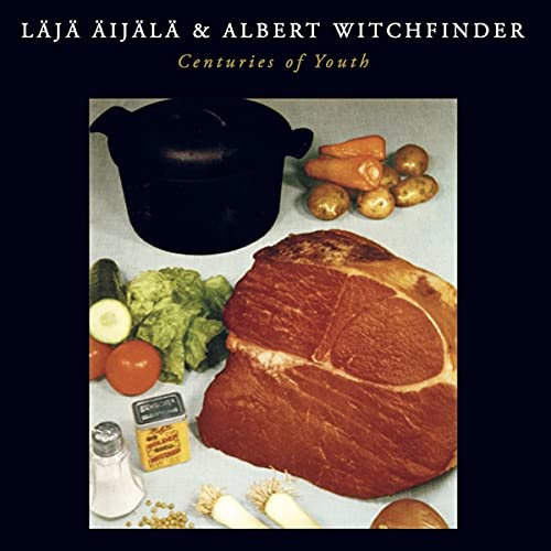 Album cover featuring a large ham, vegetables, a cooking pot, and condiments on table.