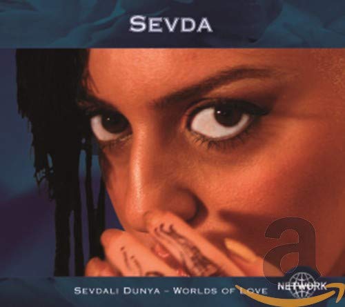 CD cover featuring a close-up portrait of a woman with dark hair.