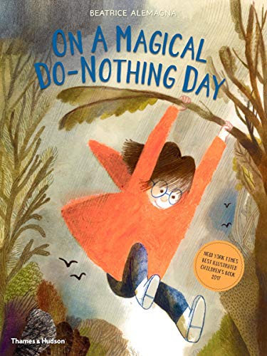 A child in an orange coat swings from a tree branch in the rain.