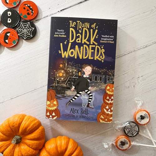 Book cover with a train, girl, and pumpkins surrounded by Halloween decorations.