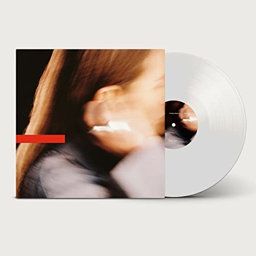 Vinyl record with album art featuring a blurred portrait of a woman.