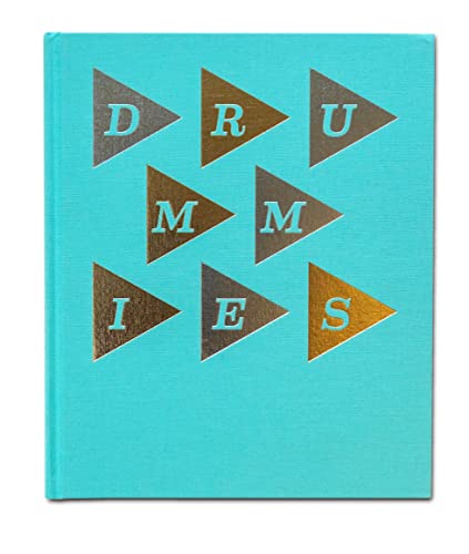 Blue book cover with gold triangular letters spelling "DRUMMIES".