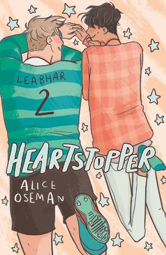 Cover of “Heartstopper 2 as Gaeilge,” two young men embracing.