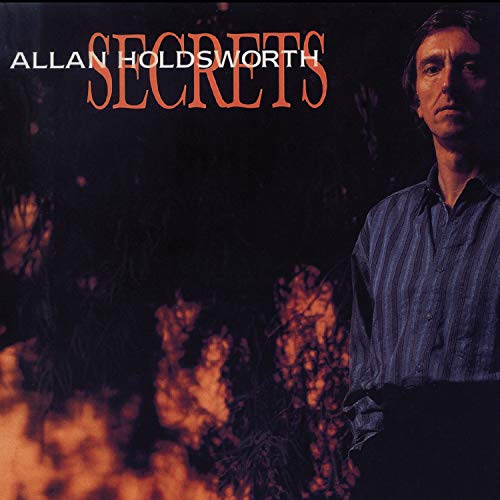 Album cover for Secrets by Allan Holdsworth featuring a man in a striped shirt.