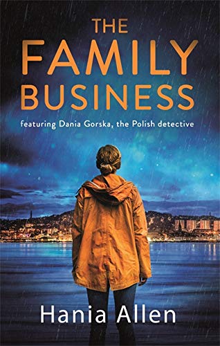 Book cover: woman in orange jacket overlooking a lit city at night.